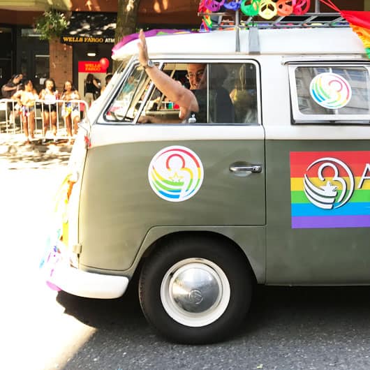 Attorney Arthur Leritz driving his vintage VW van at Seattle pride