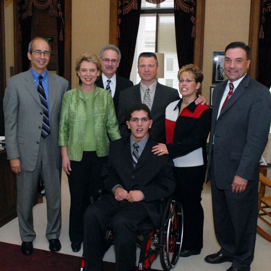 Attorney Richard Adler, Gov. Christine Gregoire, Stanley Herring MD, Zackery Lystedt, and the Lystedt family at the signing of the Zackery Lystedt Law